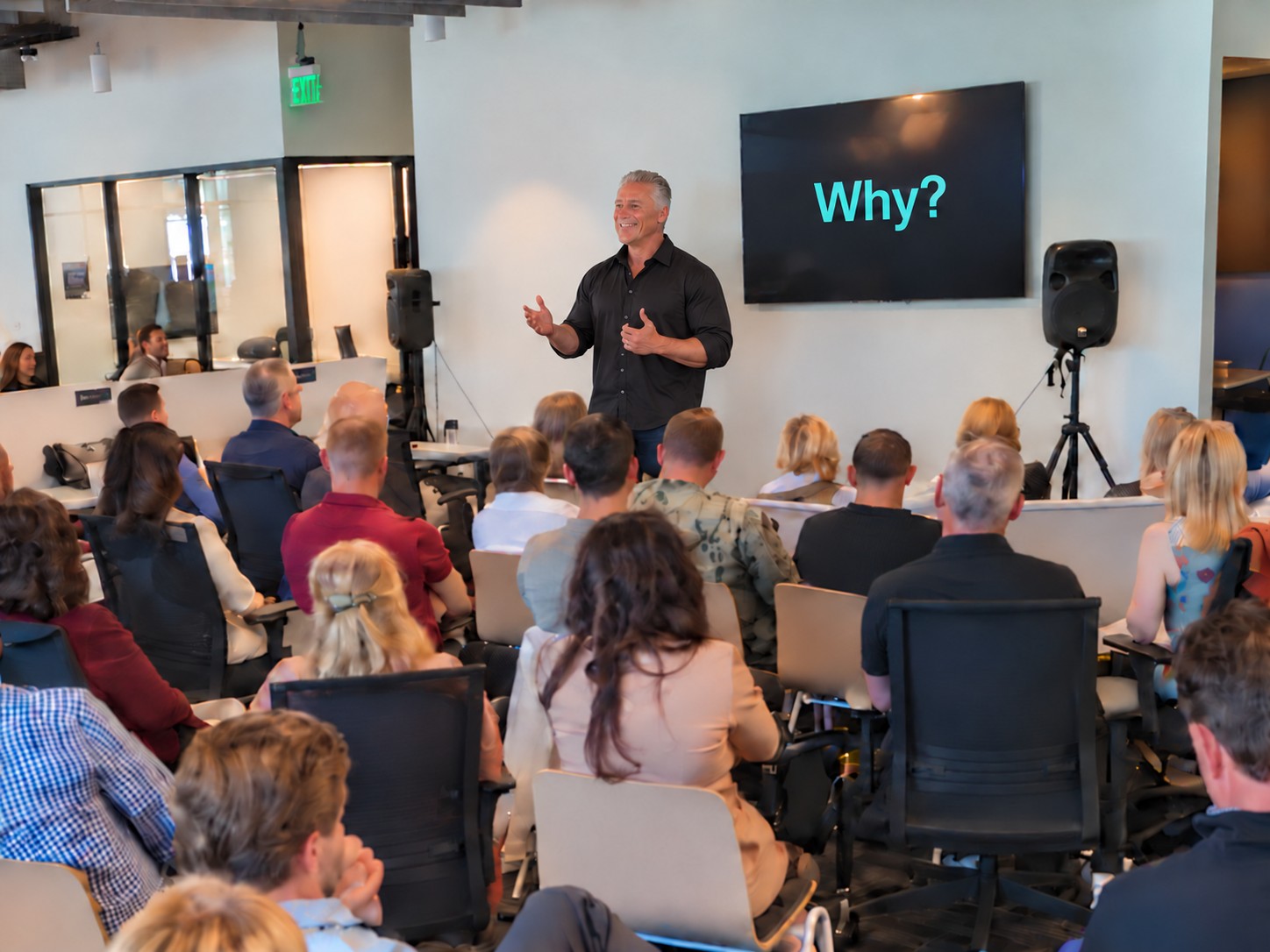 Sean Purcell speaking to a full room of business professionals